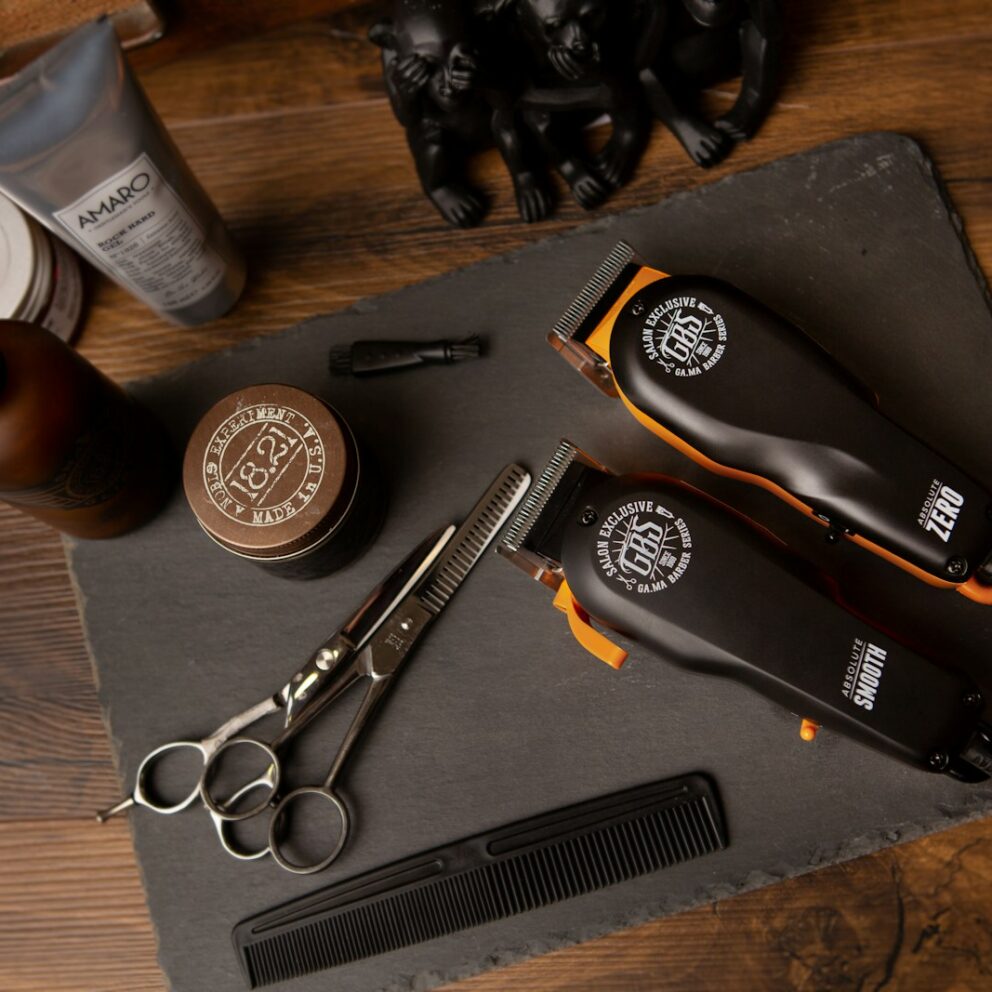 black and silver pocket knife beside silver round coins